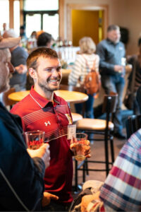 Networking (1) Image of a few LABA members networking and smiling at a monthly meeting.